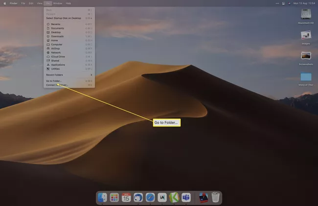 Escritorio de Mac con la opción Ir a la carpeta resaltada en Finder.